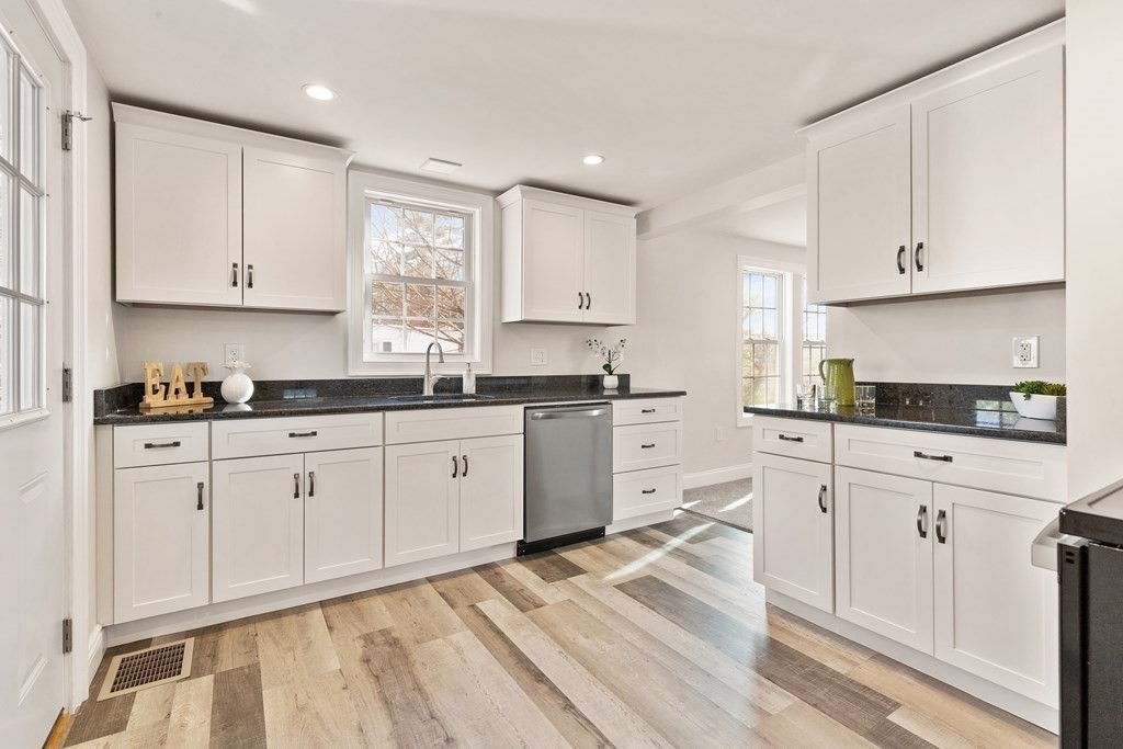 2 Pine Grove Road Westford, MA 01886 - Photo 4 of 27 a kitchen with granite countertop white cabinets white appliances and granite counter tops
