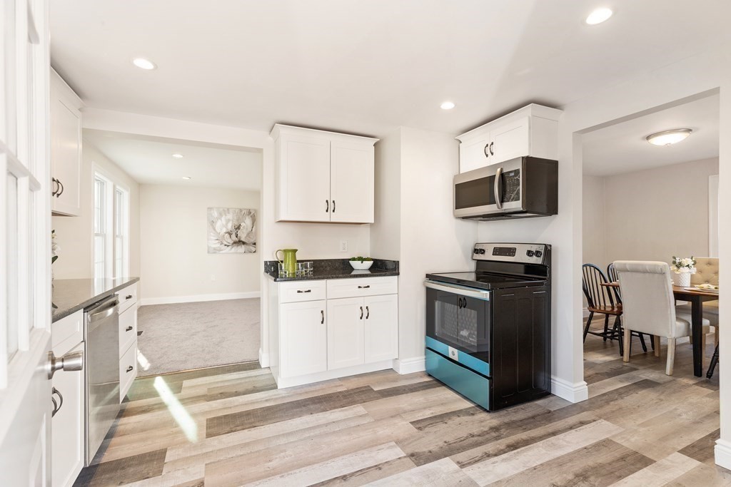 2 Pine Grove Road Westford, MA 01886 - Photo 5 of 27 a kitchen with stainless steel appliances a stove microwave and sink