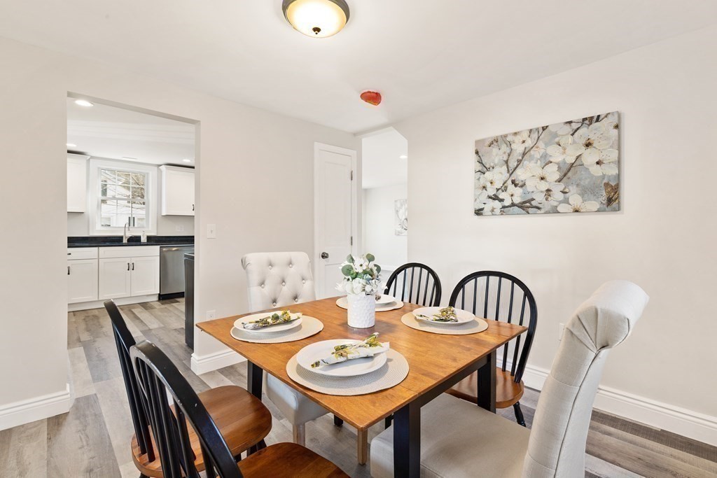 2 Pine Grove Road Westford, MA 01886 - Photo 6 of 27 a view of a dining room with furniture and wooden floor
