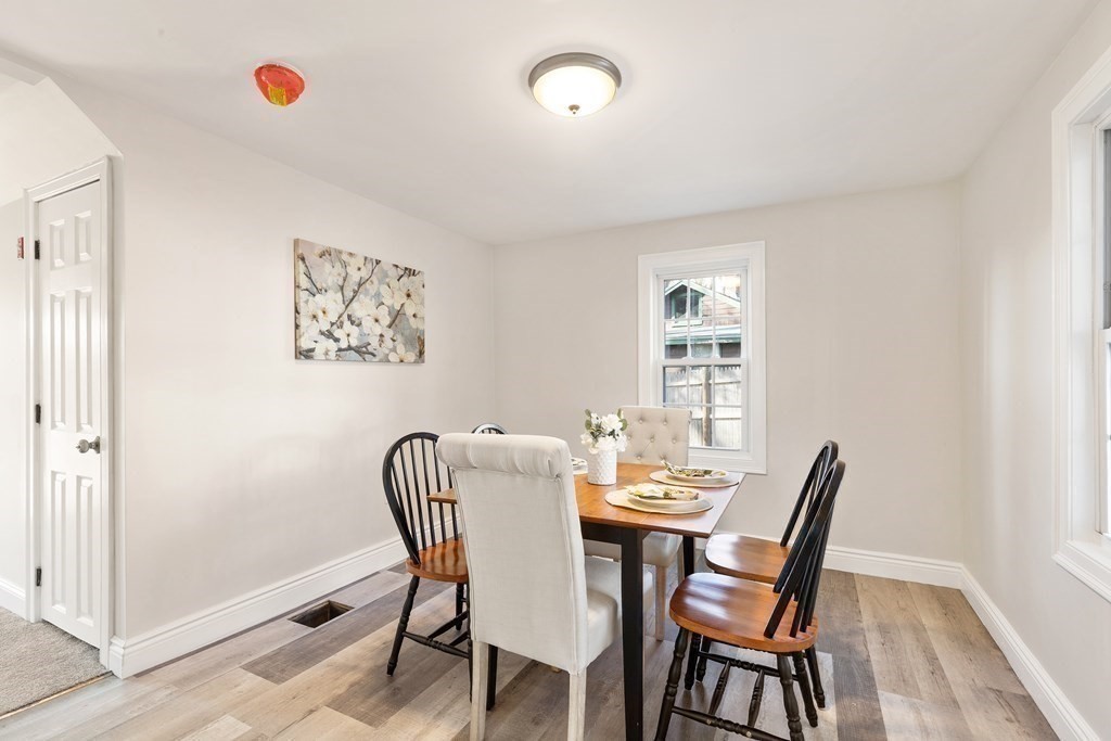 2 Pine Grove Road Westford, MA 01886 - Photo 7 of 27 a dining room with furniture and wooden floor
