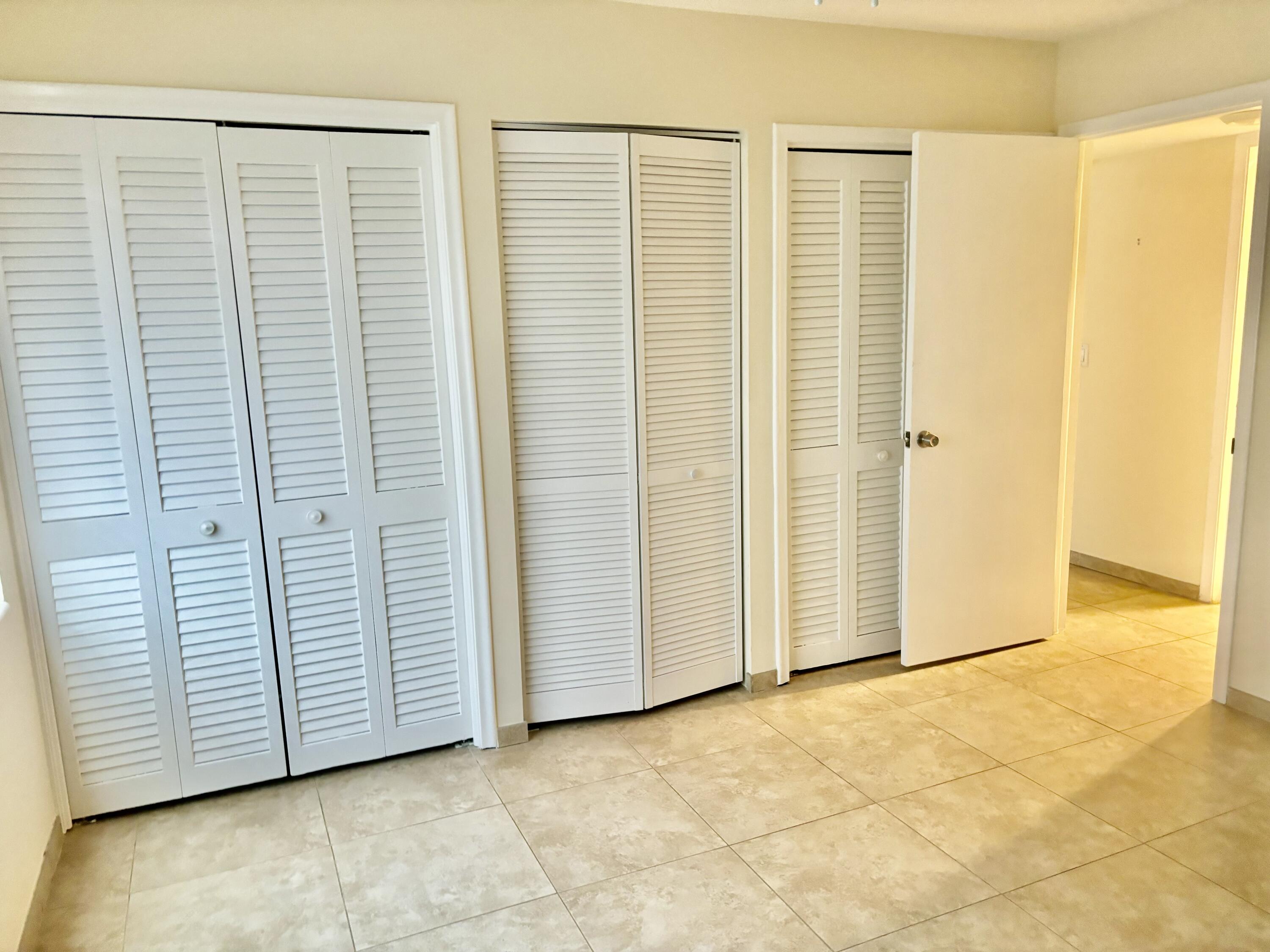 200 Main Boulevard, Unit 2D Boynton Beach, FL 33435 - Photo 14 of 26 an empty room with windows