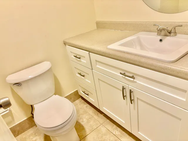 a bathroom with a toilet and a sink
