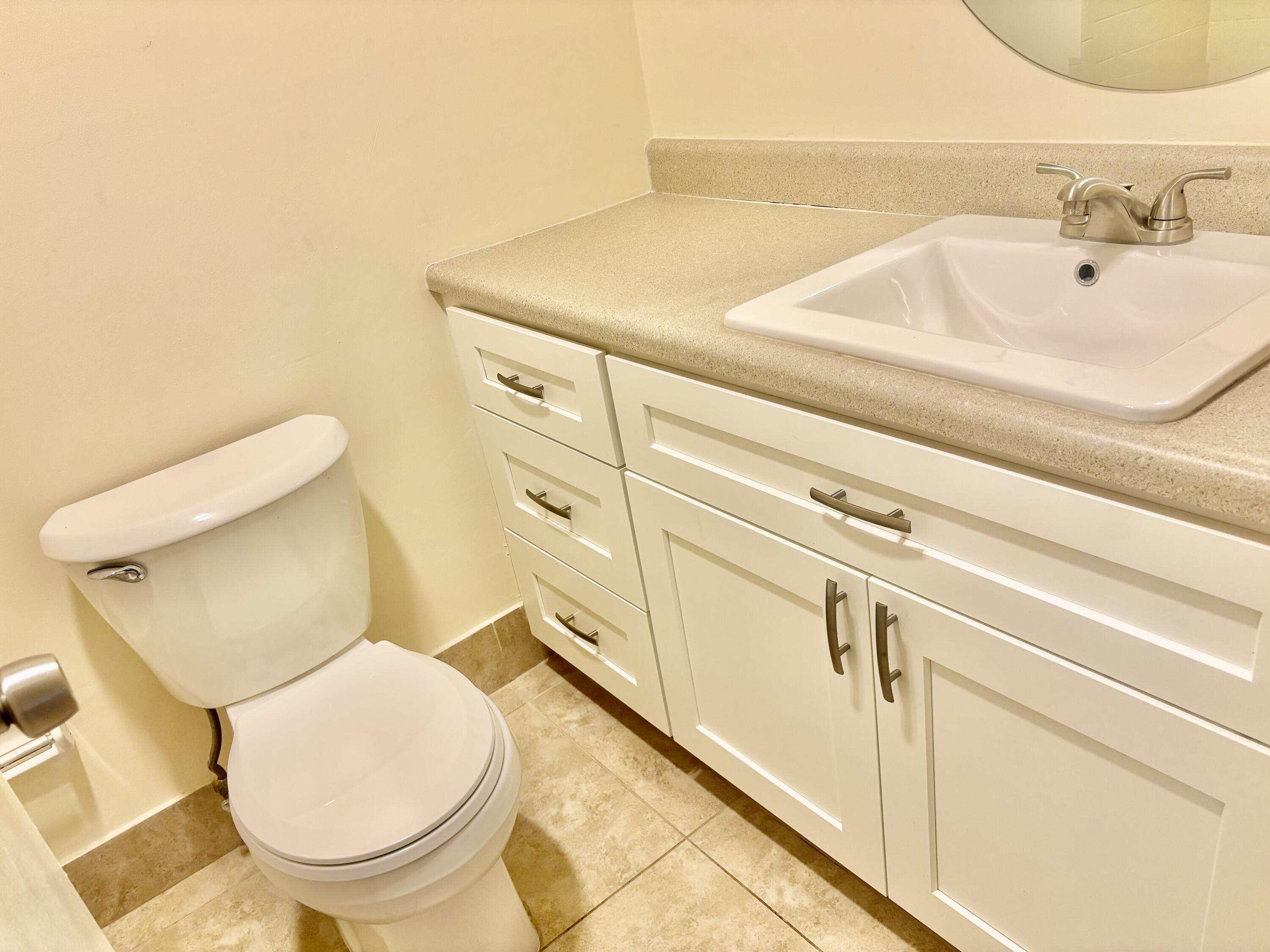 200 Main Boulevard, Unit 2D Boynton Beach, FL 33435 - Photo 17 of 26 a bathroom with a toilet and a sink