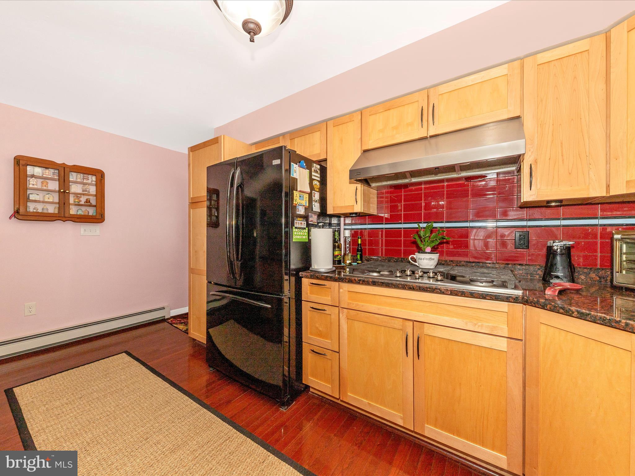 15809 Mt Everest Lane Silver Spring, MD 20906 - Photo 11 of 52 a kitchen with stainless steel appliances granite countertop a refrigerator and a stove top oven
