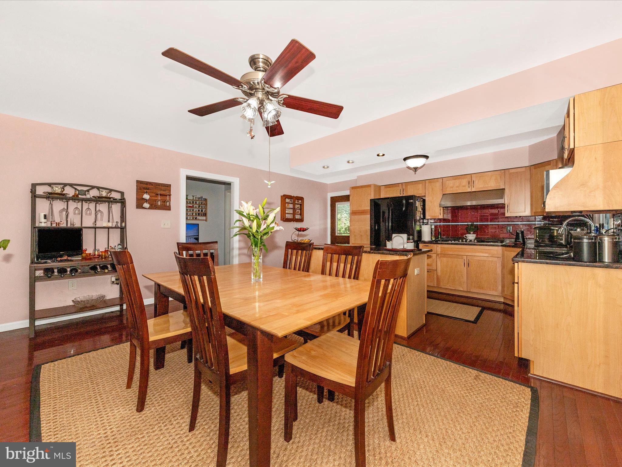 15809 Mt Everest Lane Silver Spring, MD 20906 - Photo 13 of 52 a view of a dining room with furniture and wooden floor