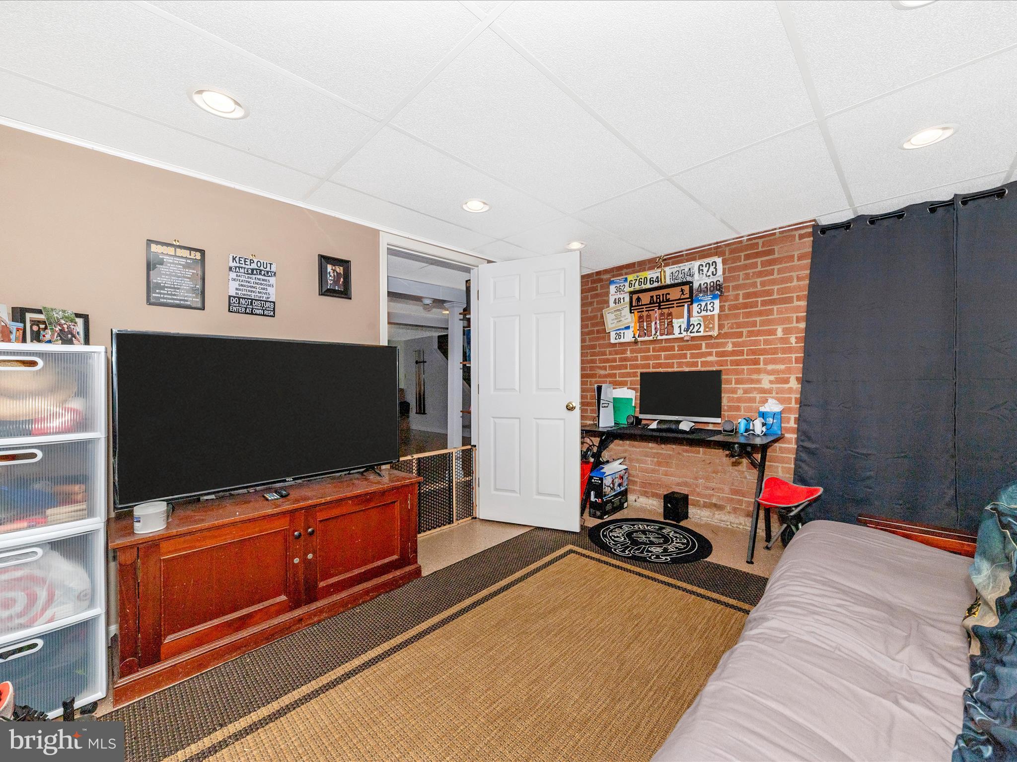 15809 Mt Everest Lane Silver Spring, MD 20906 - Photo 35 of 52 a living room with furniture and a flat screen tv