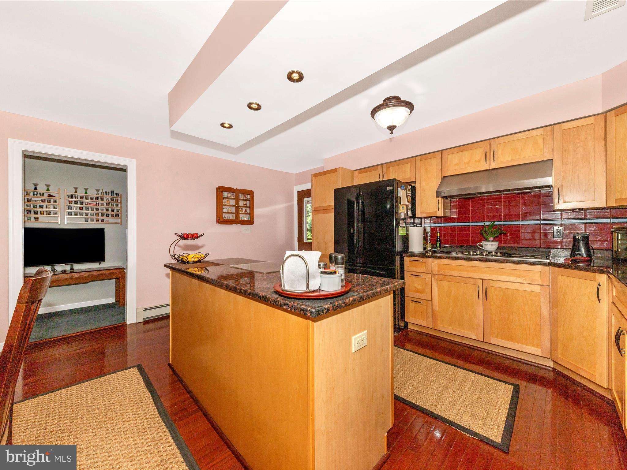 15809 Mt Everest Lane Silver Spring, MD 20906 - Photo 10 of 52 a kitchen with stainless steel appliances granite countertop a sink and cabinets