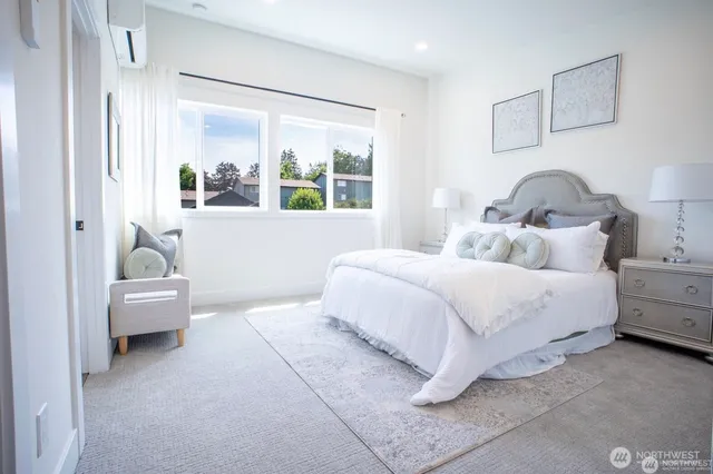 a bedroom with bed and a window