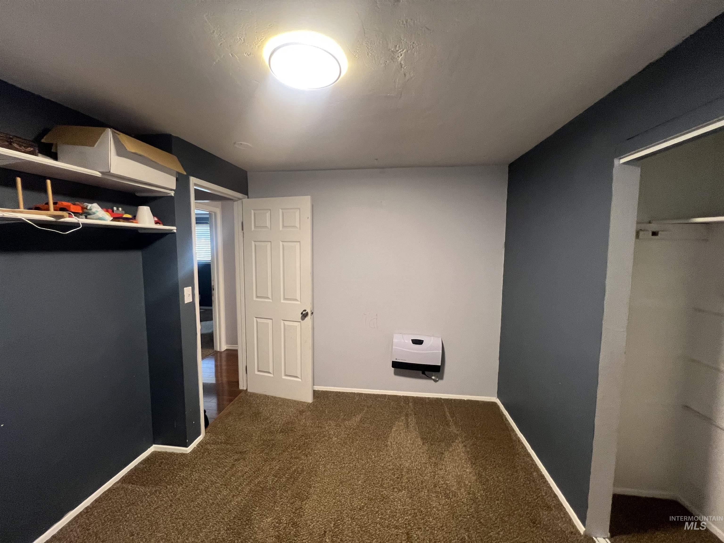 908 13th Street Kamiah, ID 83536 - Photo 12 of 12 Unfurnished bedroom with baseboards and carpet flooring