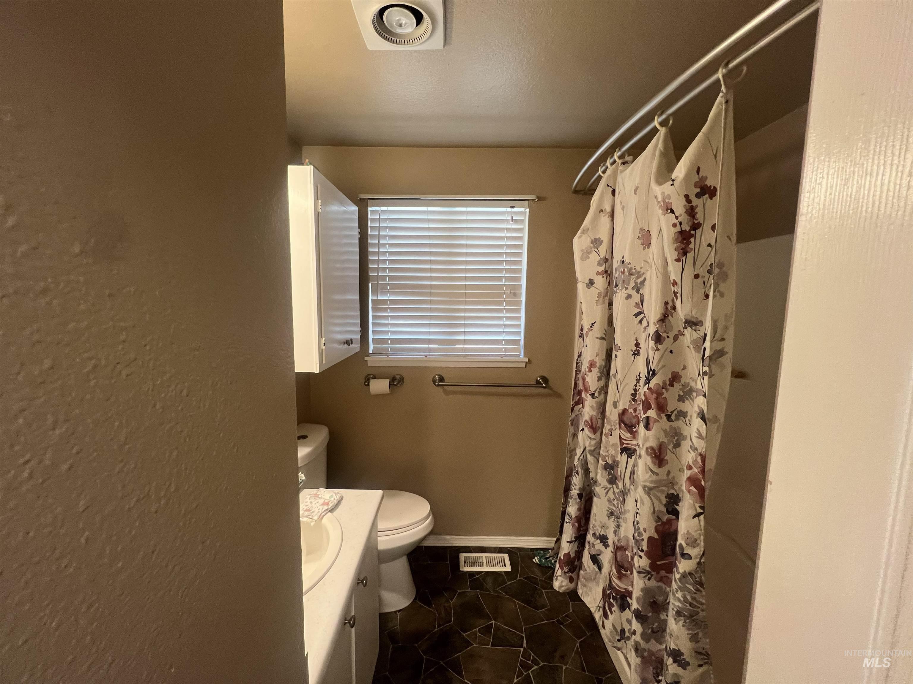 908 13th Street Kamiah, ID 83536 - Photo 8 of 12 Full bathroom with vanity and curtained shower