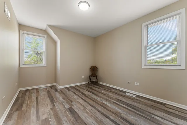 a bathroom with a granite countertop sink mirror and toilet
