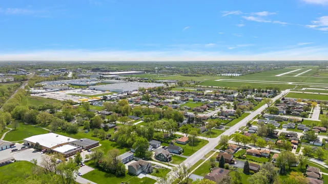 an aerial view of residential houses with city view