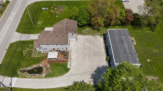 an aerial view of a house with garden space ocean view