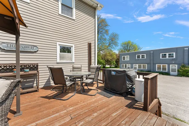a outdoor space with patio furniture and white umbrella