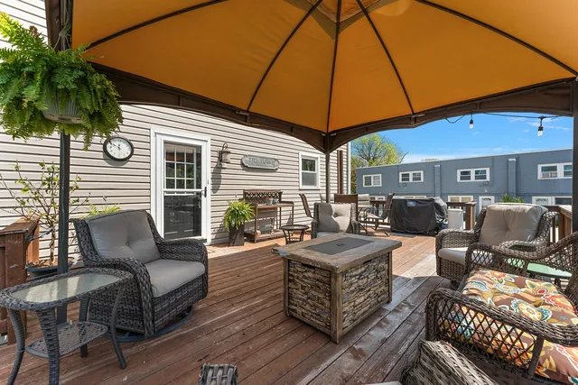 a front view of a house with yard and patio