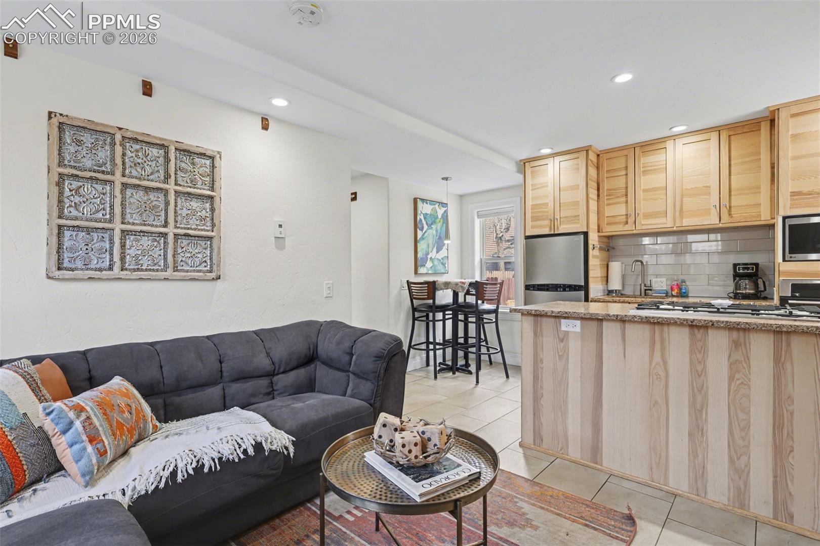 1702 1/2 West Cheyenne Road Colorado Springs, CO 80906 - Photo 7 of 29 Off the living room area is the kitchen for all of your cooking and baking dreams to come to life!
