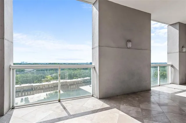 a view of an empty room with a large window