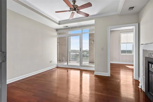 wooden floor in an empty room with a window