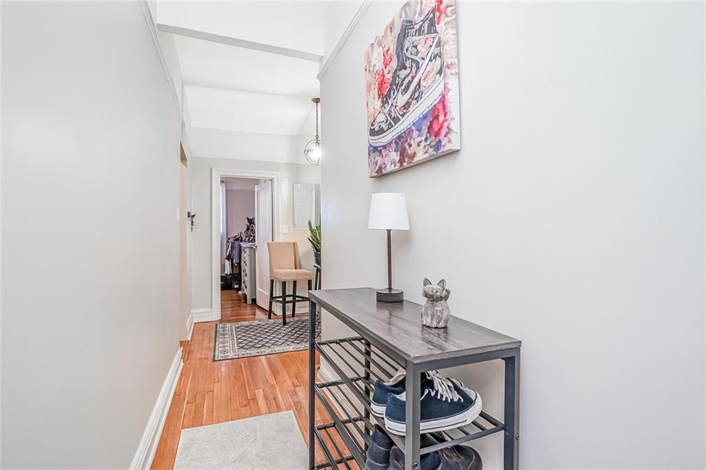 255 79th Street, Unit E2 Brooklyn, NY 11209 - Photo 12 of 14 a view of a hallway with a table and chairs
