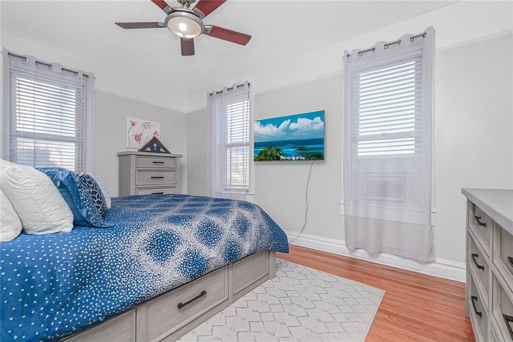 255 79th Street, Unit E2 Brooklyn, NY 11209 - Photo 9 of 14 a bedroom with a bed and a flat screen tv