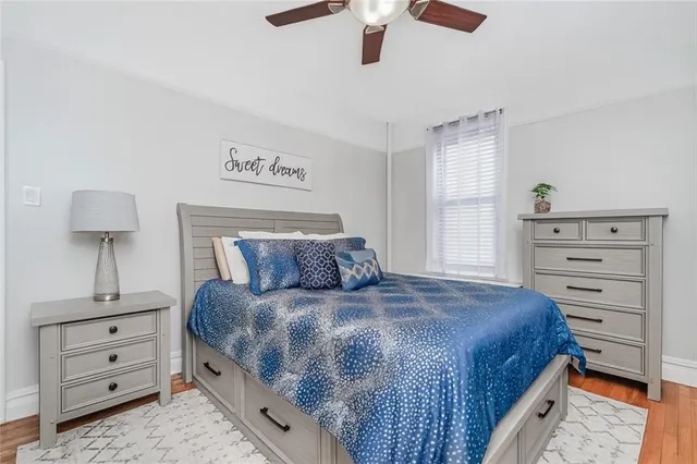 a bedroom with a bed and a dresser