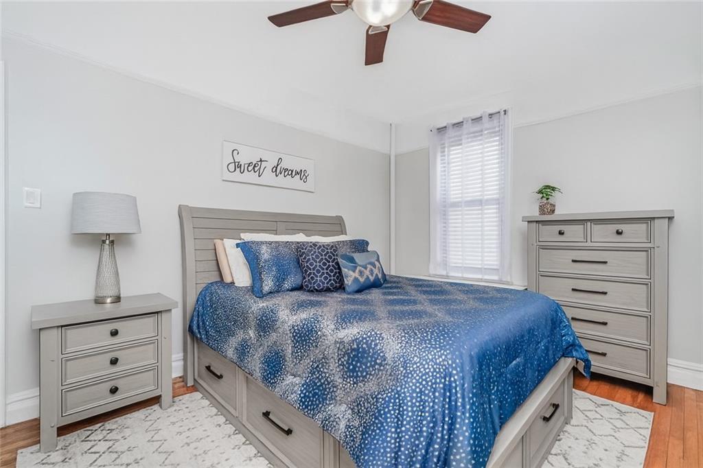 255 79th Street, Unit E2 Brooklyn, NY 11209 - Photo 10 of 14 a bedroom with a bed and a dresser