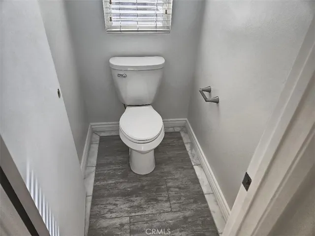 a bathroom with a toilet and a sink