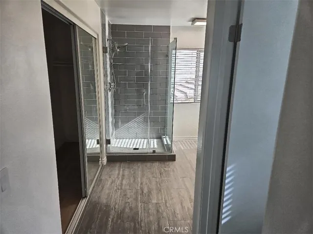 a view of a bathroom with a glass door shower