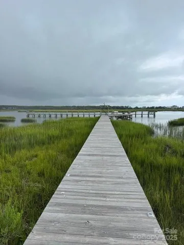 a kitchen with a table chairs stove and cabinets