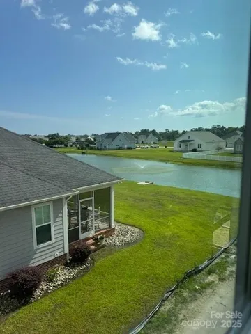 a view of a golf course with a lake