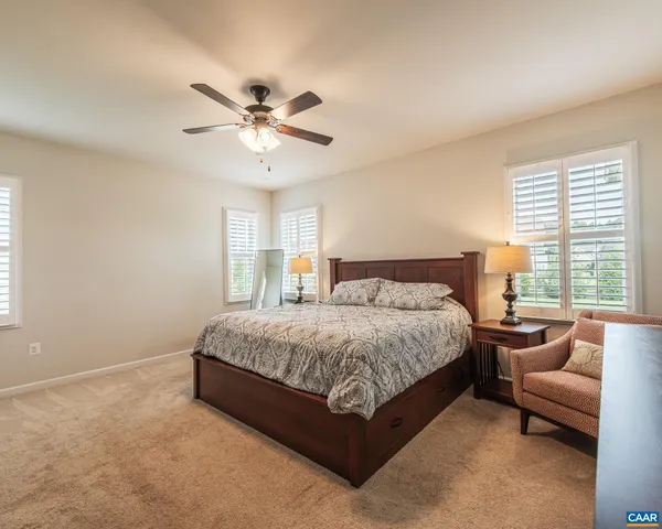 a view of a white house with a yard