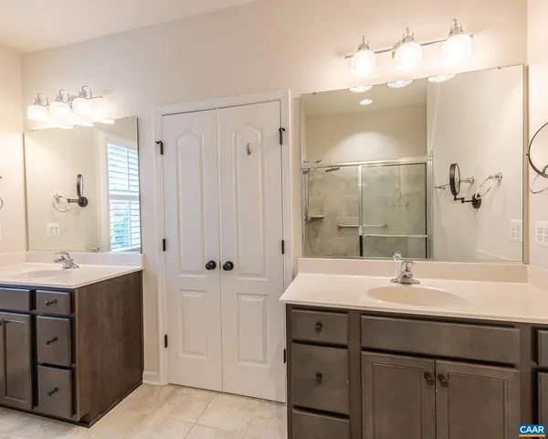 an aerial view of residential houses with outdoor space and swimming pool