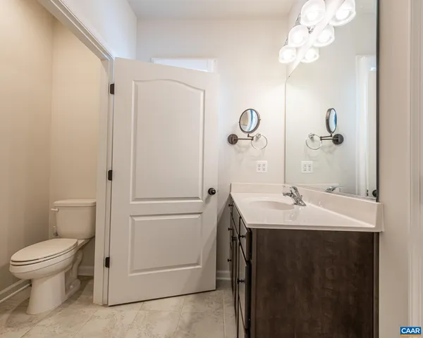 an aerial view of residential houses with outdoor space and swimming pool