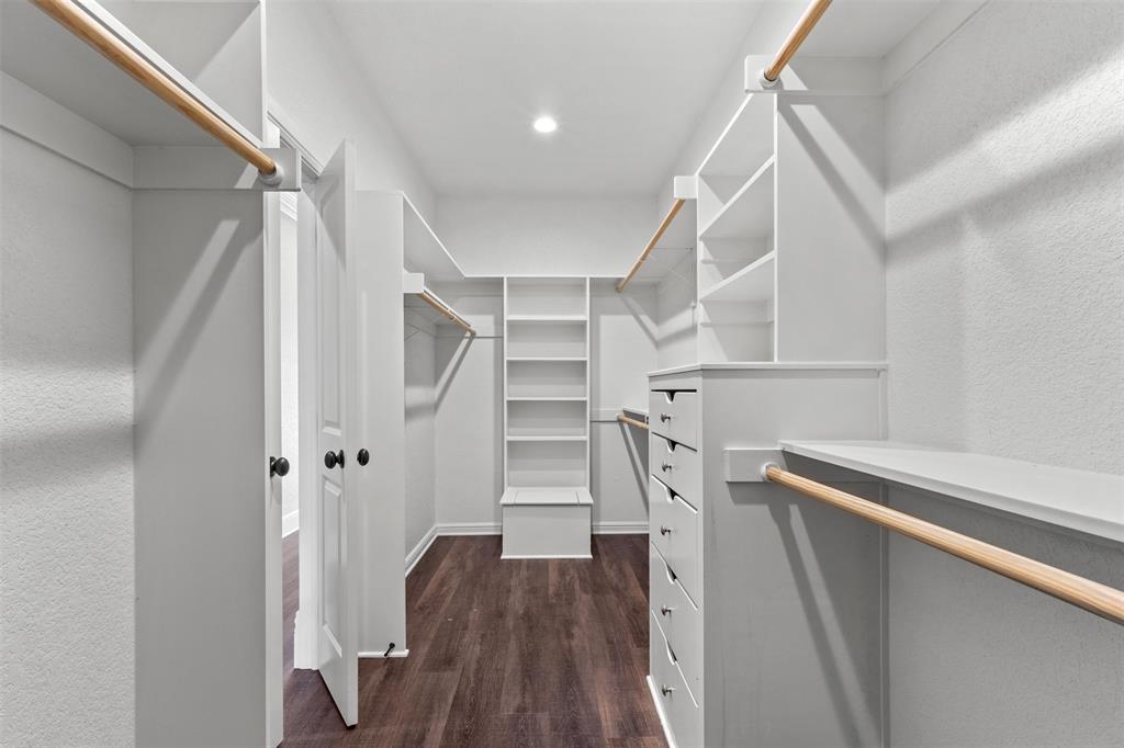 910 County Road 1111 Decatur, TX 76234 - Photo 37 of 40 Walk in closet featuring dark wood-type flooring