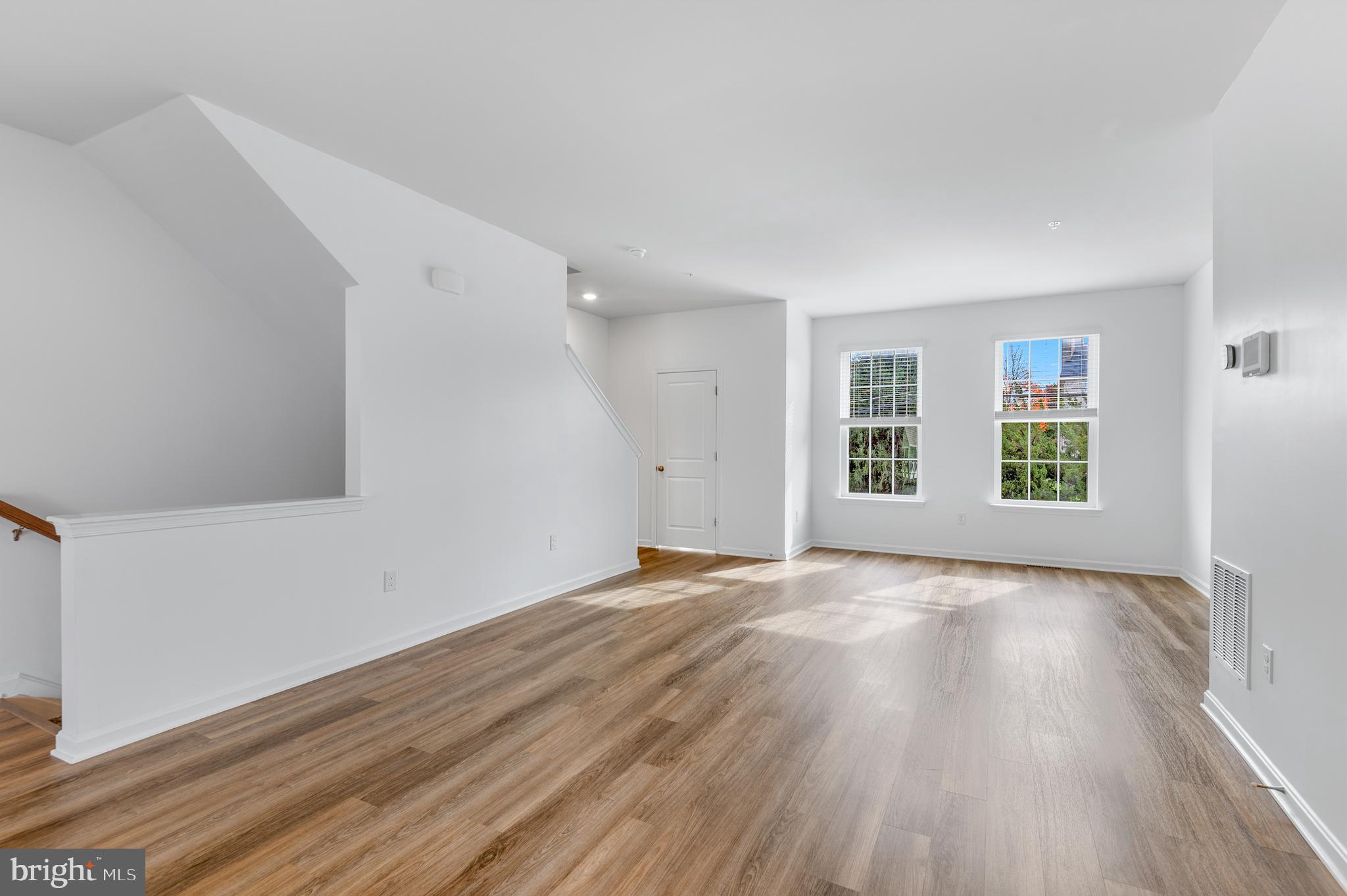 8612 Walter Martz Road Frederick, MD 21702 - Photo 11 of 51 wooden floor in an empty room with a window