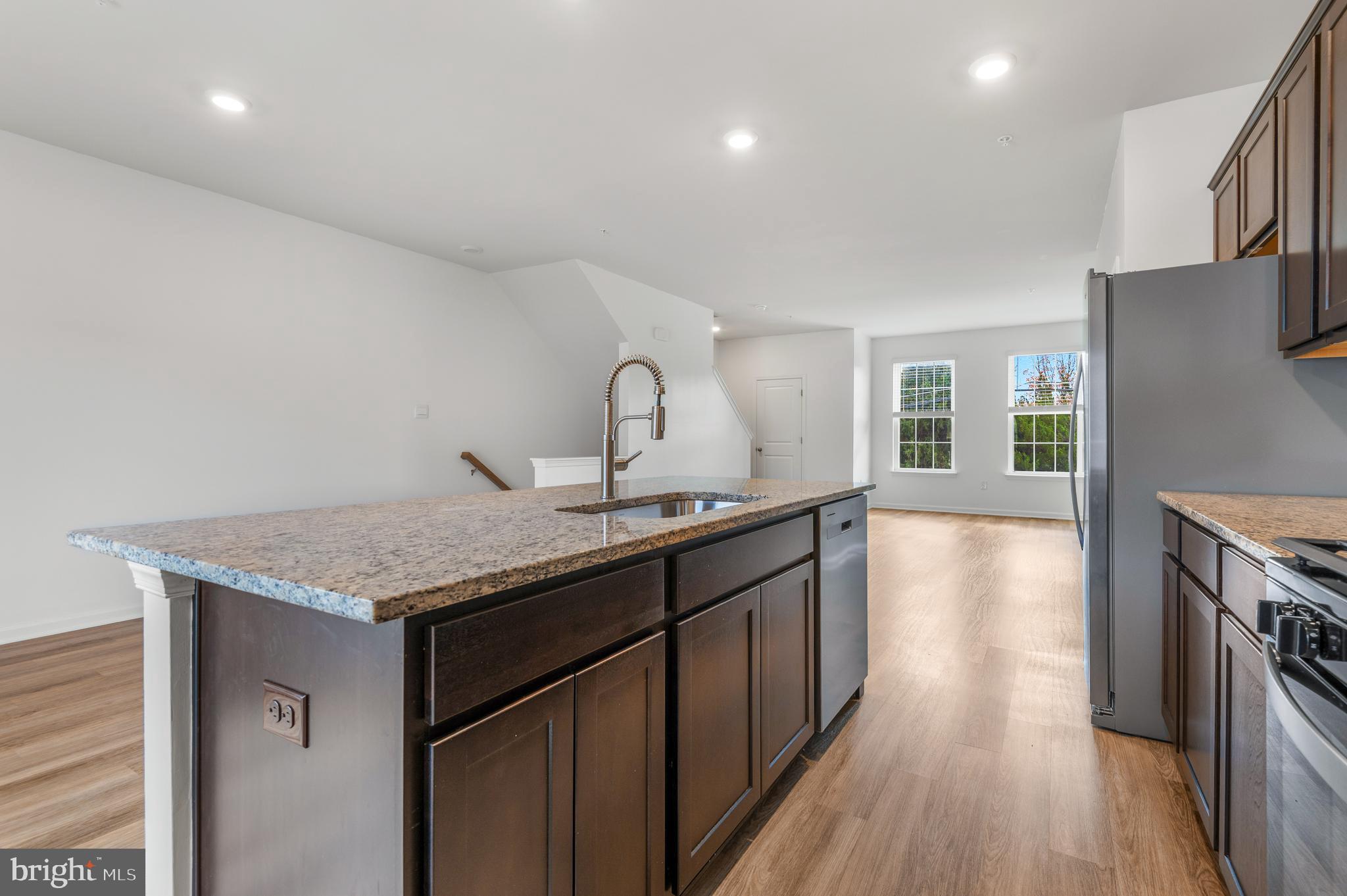 8612 Walter Martz Road Frederick, MD 21702 - Photo 20 of 51 a kitchen with granite countertop a stove and a wooden floors