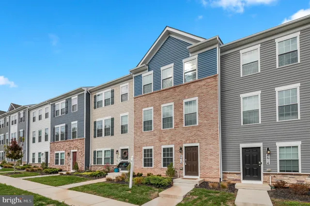 a front view of a building with a yard