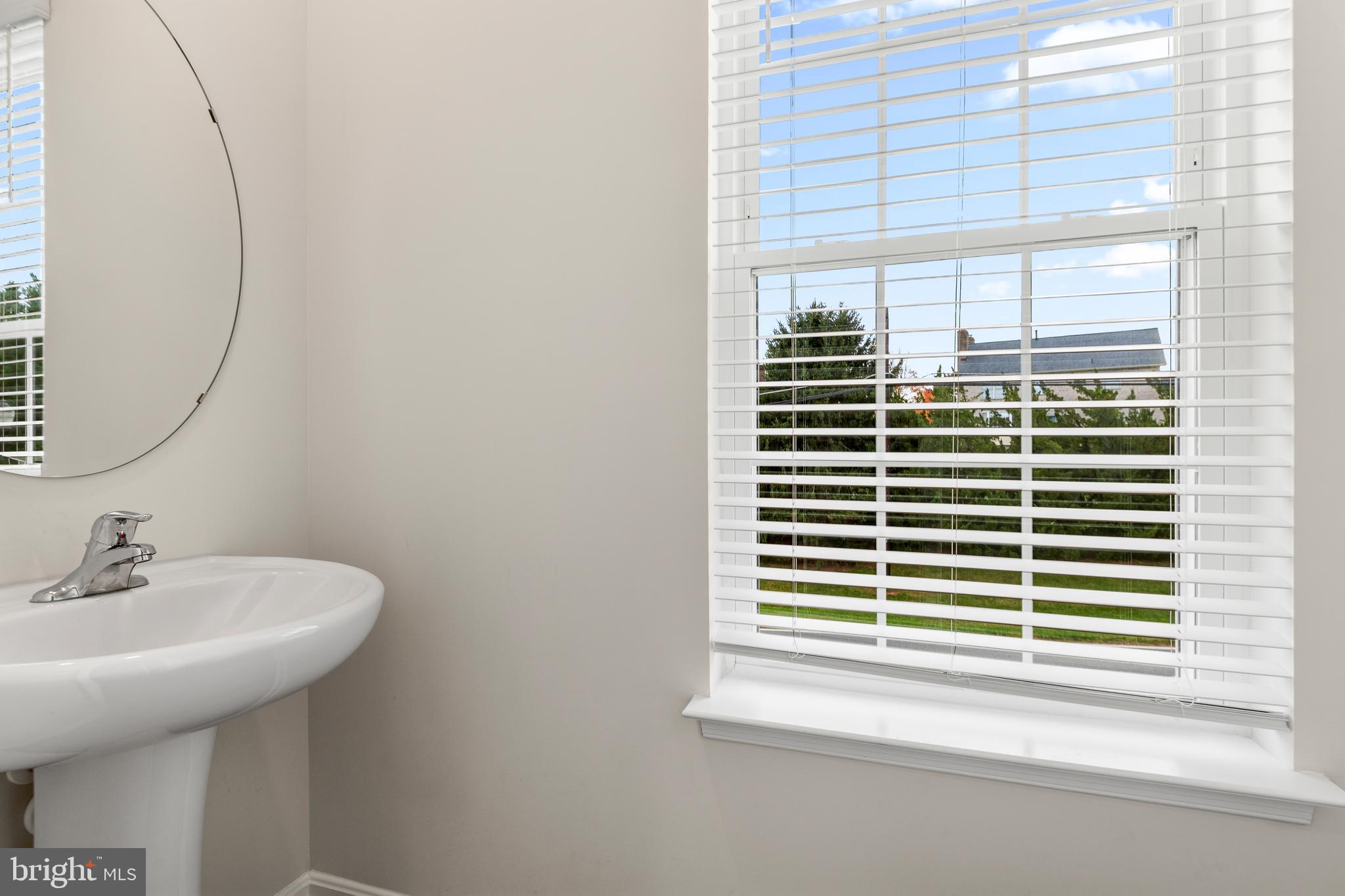 8612 Walter Martz Road Frederick, MD 21702 - Photo 23 of 51 a bathroom with a sink and a window