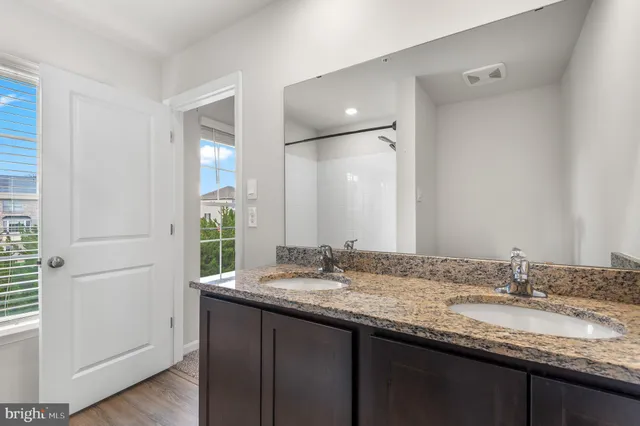 a bathroom with a bath tub with a shower
