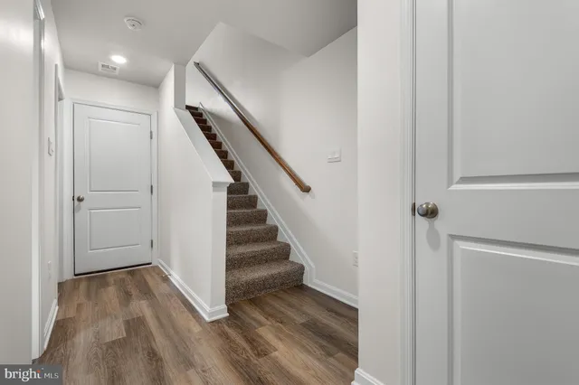 a view of entryway with wooden floor