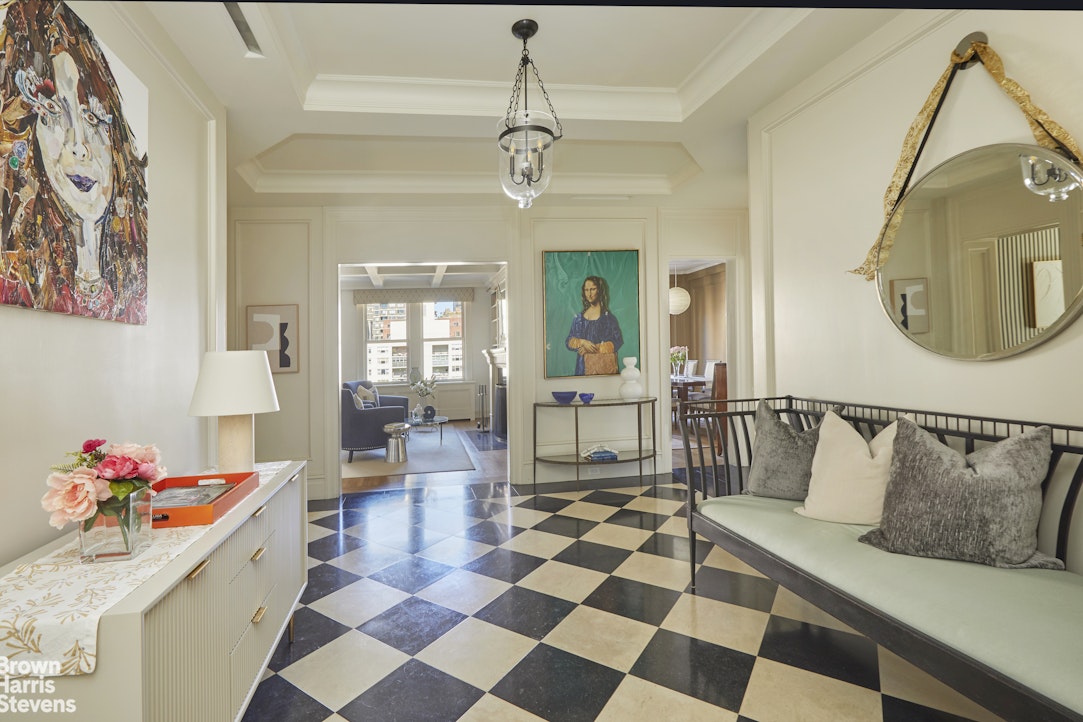 64 East 86th Street, Unit 12AB Manhattan, NY 10028 - Photo 2 of 15 a living room with a black white checkered floor with couches chair and a coffee table