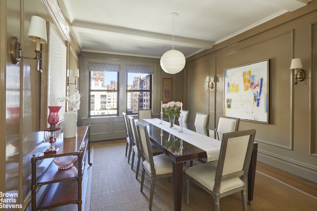 64 East 86th Street, Unit 12AB Manhattan, NY 10028 - Photo 3 of 15 a view of a dining room with furniture and a large window