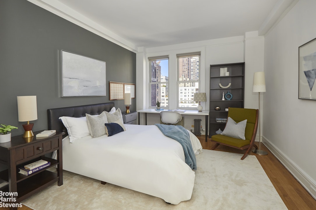 64 East 86th Street, Unit 12AB Manhattan, NY 10028 - Photo 7 of 15 a bedroom with a bed and a couch