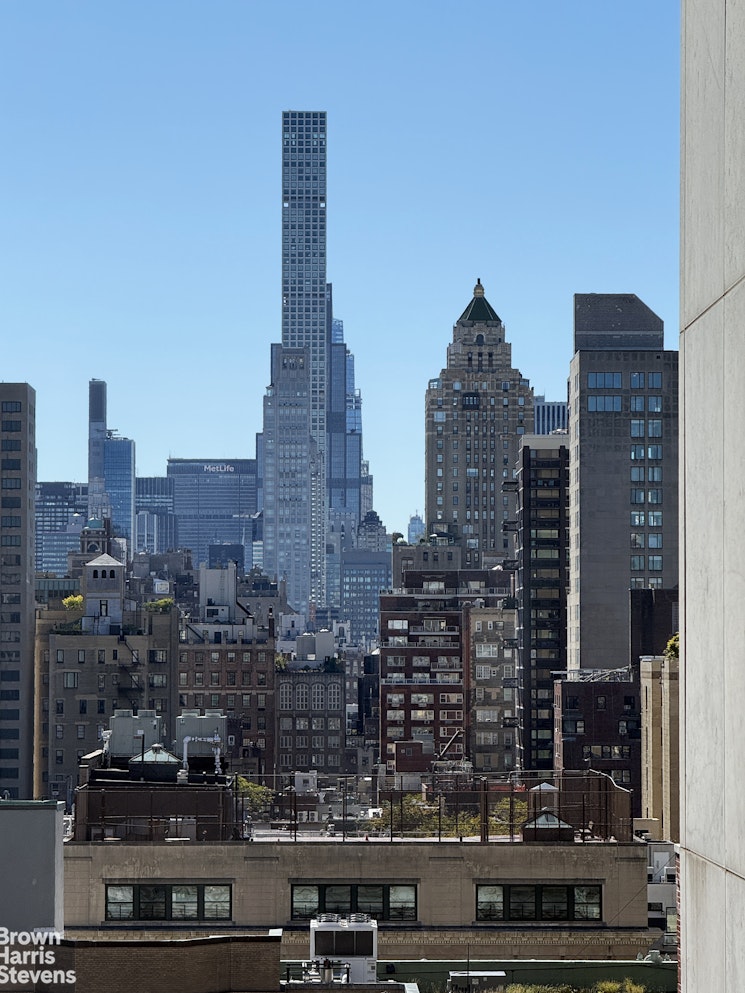 64 East 86th Street, Unit 12AB Manhattan, NY 10028 - Photo 9 of 15 a city view with tall buildings