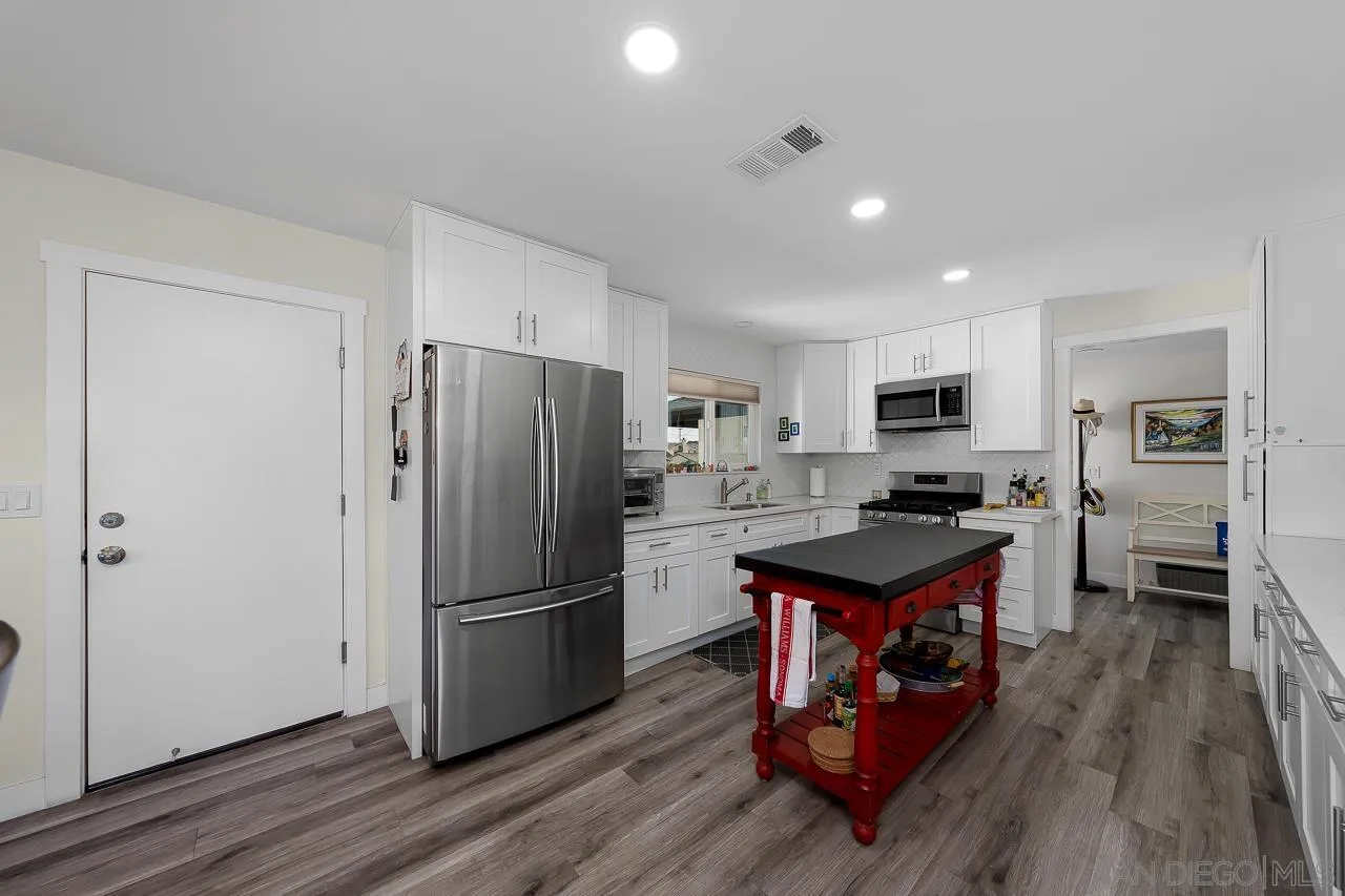 1761 Harvard Street Chula Vista, CA 91913 - Photo 12 of 41 a open kitchen with stainless steel appliances granite countertop a refrigerator stove top oven and sink