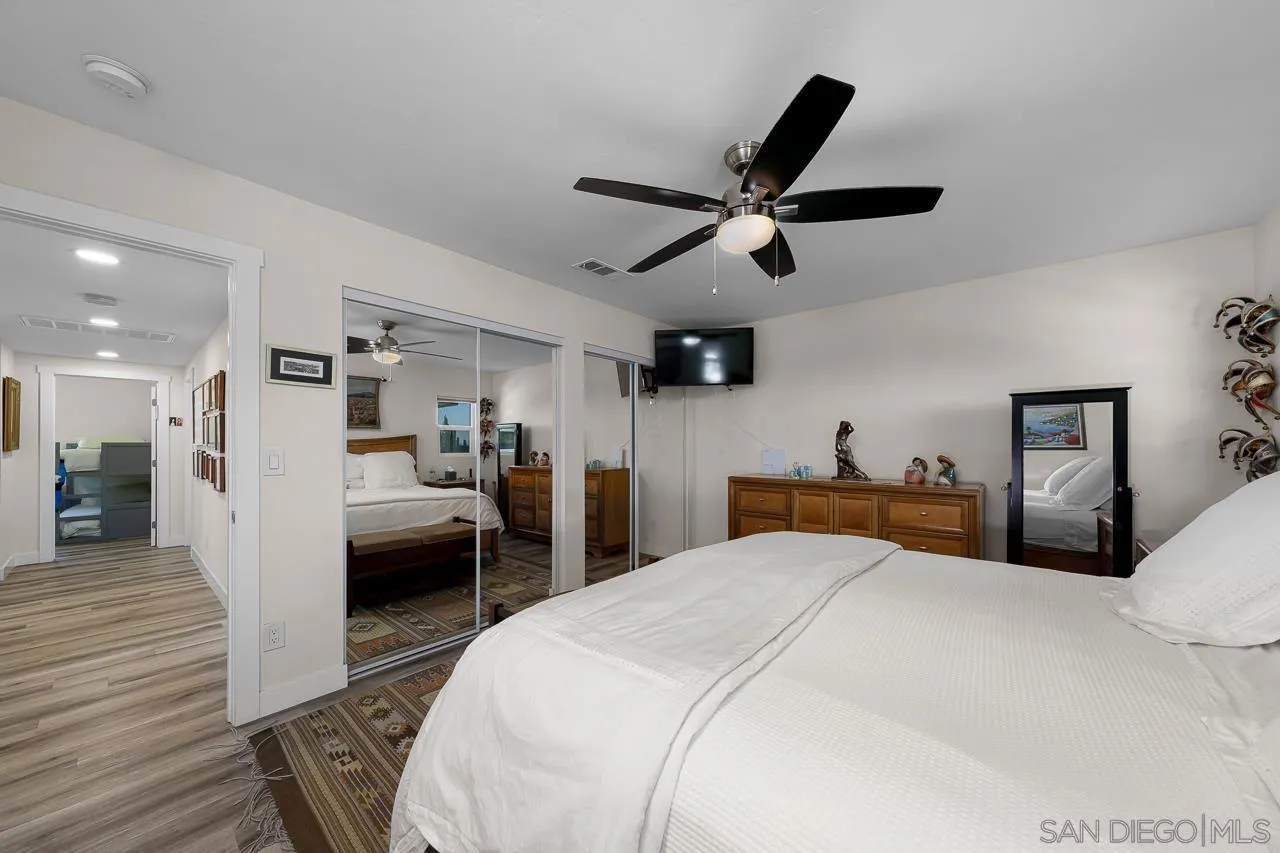 1761 Harvard Street Chula Vista, CA 91913 - Photo 16 of 41 a bedroom with a bed and a large mirror