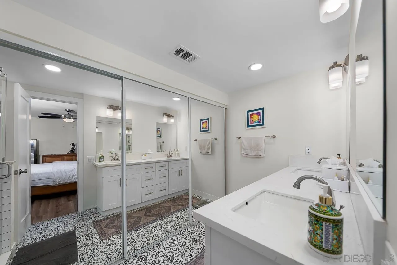 1761 Harvard Street Chula Vista, CA 91913 - Photo 18 of 41 a bathroom with a tub sink and mirror