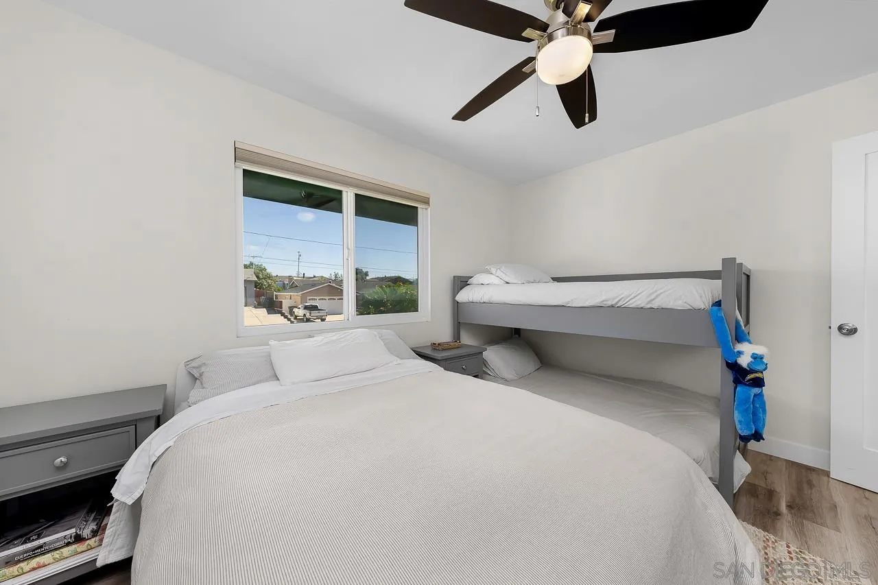 1761 Harvard Street Chula Vista, CA 91913 - Photo 21 of 41 a bedroom with a bed and a ceiling fan
