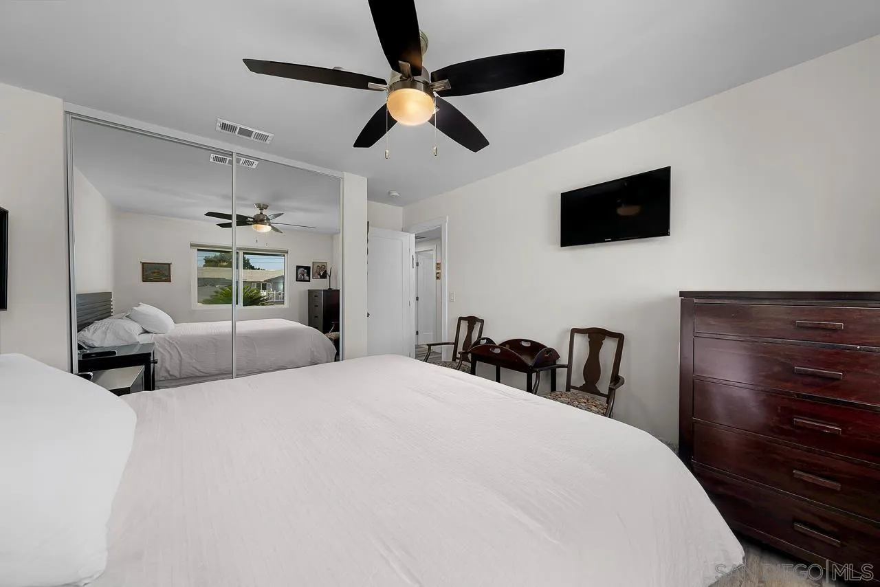 1761 Harvard Street Chula Vista, CA 91913 - Photo 23 of 41 a bedroom with a bed a flat screen tv and a dresser