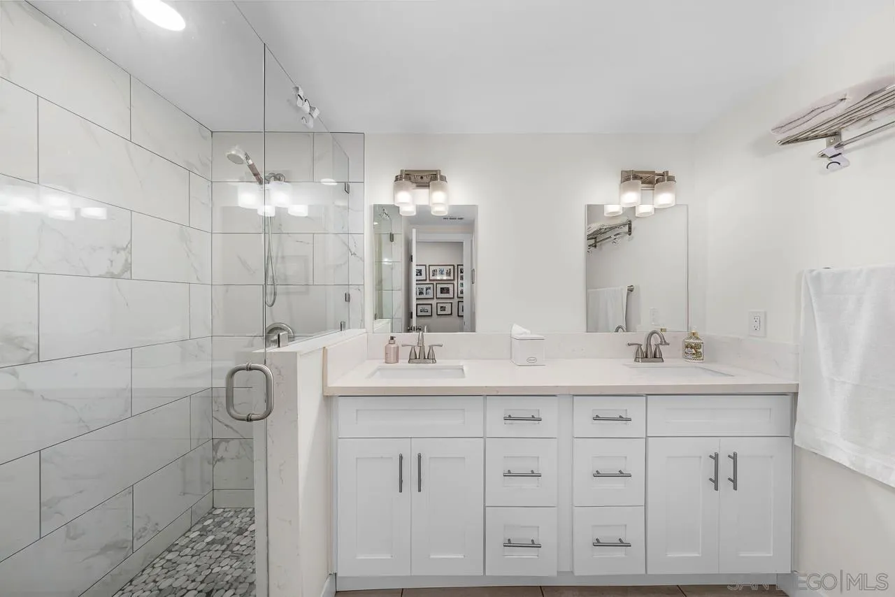 1761 Harvard Street Chula Vista, CA 91913 - Photo 24 of 41 a bathroom with a double vanity sink mirror and